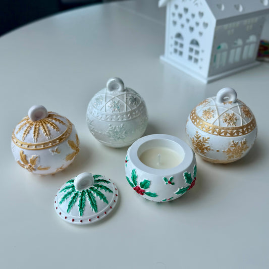 Set of decorative ceramic pots with lids on a white surface